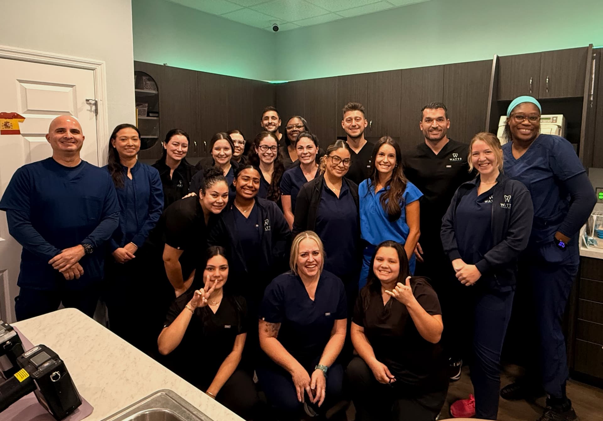 The friendly Watts Dental team gathered together in the office